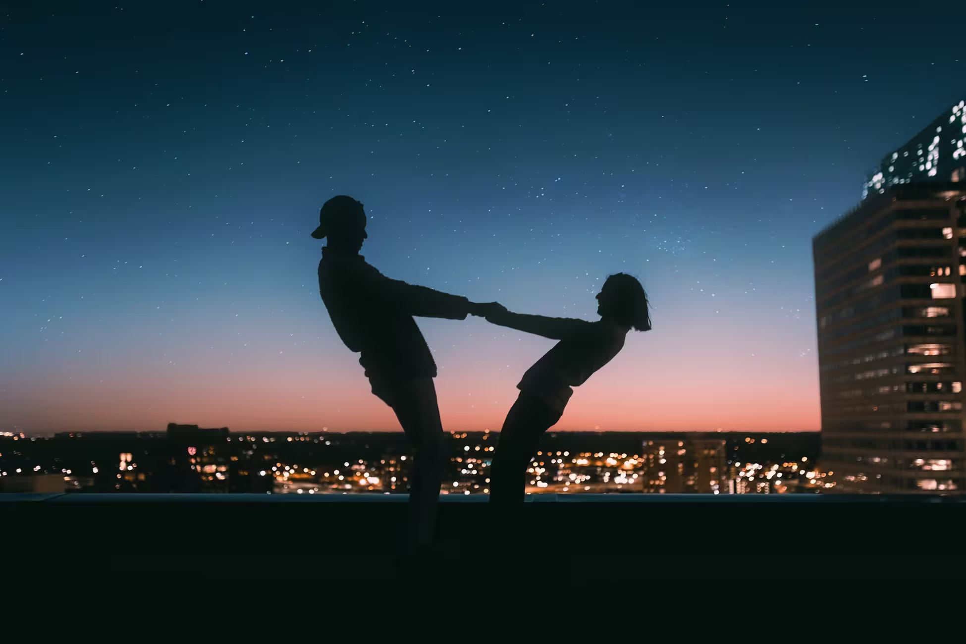 Two people meeting at dusk